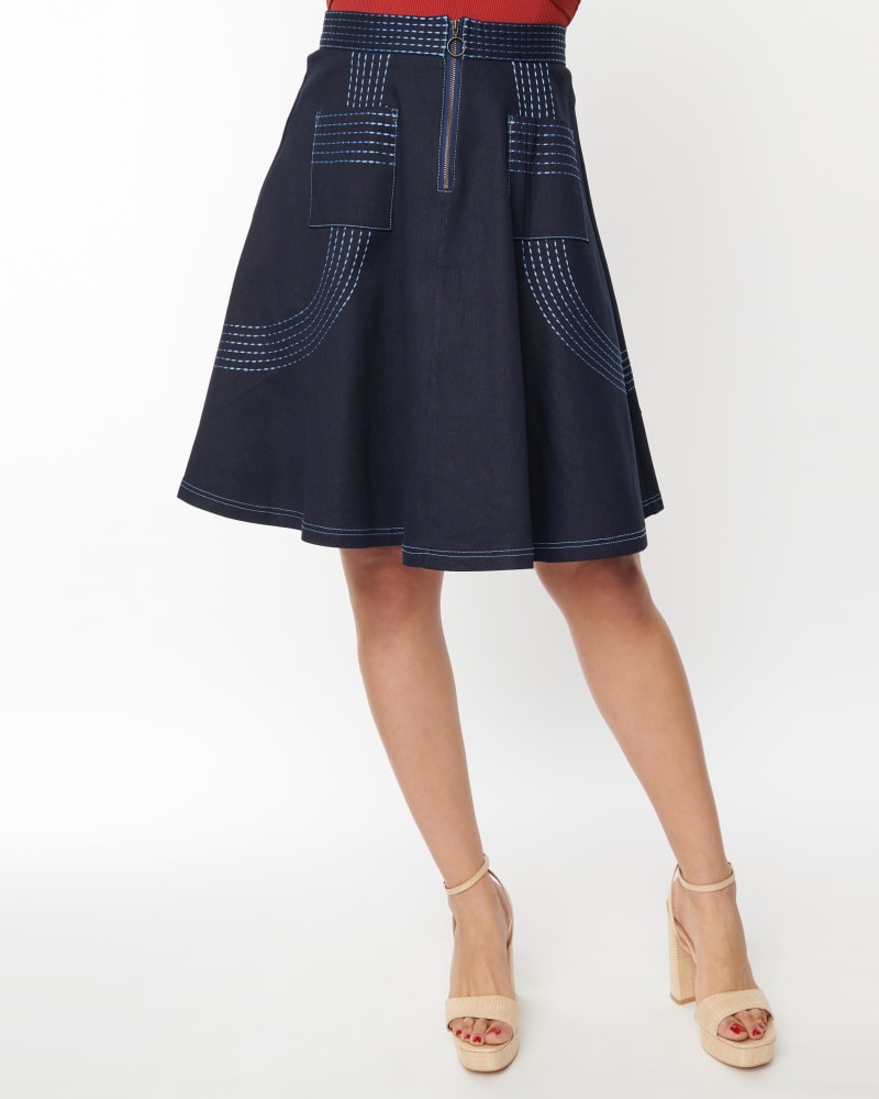 Front of a model wearing a size XL Unique Vintage Denim Blue Patch Pocket Swing Skirt in Blue by Unique Vintage. | dia_product_style_image_id:310129